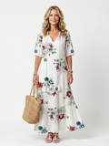 Maeva™ | Vestido Midi Floral Disperso con Nudo y Pompones