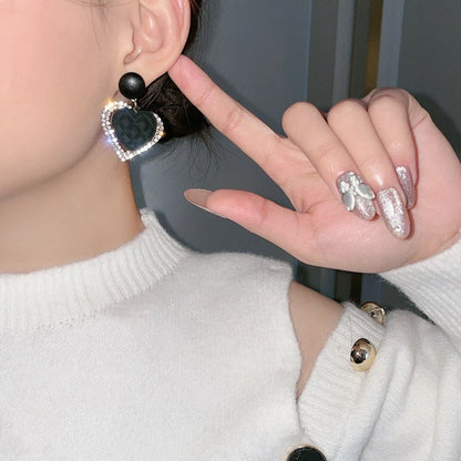 Boucles d'oreilles en cœur noir en or