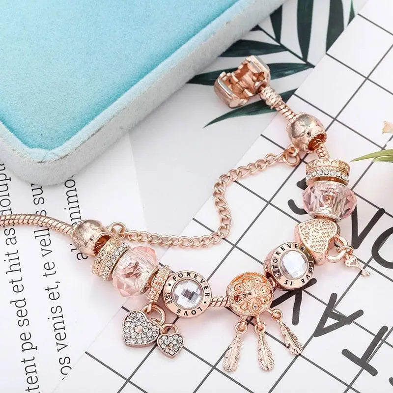Pulsera atrapasueños rosa con charms en plata de ley