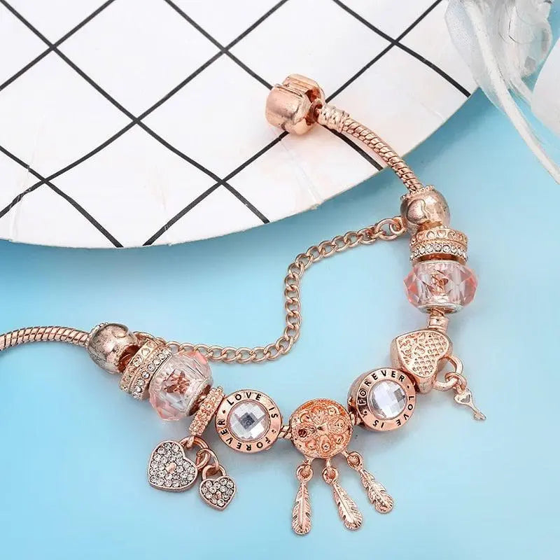 Pulsera atrapasueños rosa con charms en plata de ley