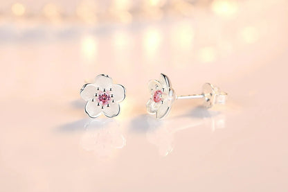 Boucles d'oreilles à bouton en forme de fleur avec zirconiums