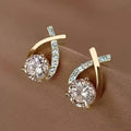 Boucles d'oreilles à puce avec croix dorée et zirconiums