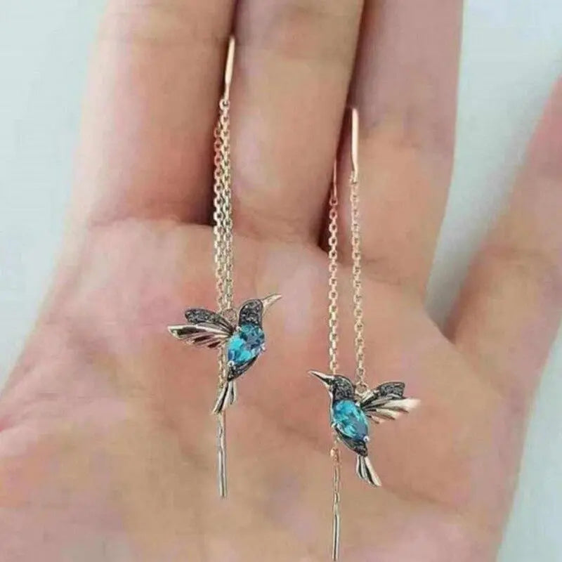 Boucles d'oreilles en fil avec colibri en or et cristaux